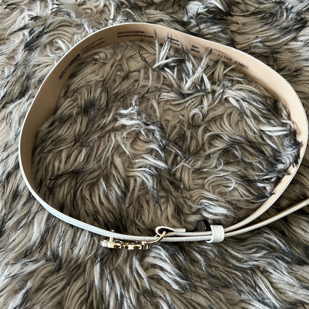 Cream belt with gold accent closure